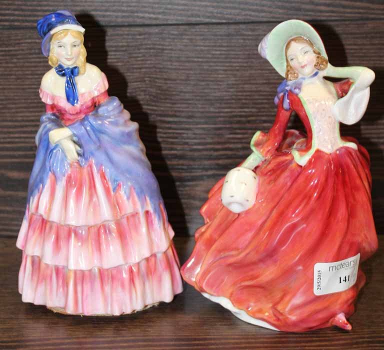 TWO ROYAL DOULTON FIGURES OF " VICTORIAN LADY " ( DAMAGED ) AND "AUTUMN BREEZES"
together with a