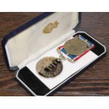 CASED NATIONAL SERVICE MEDAL
together with a half crown coin