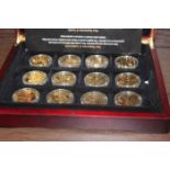 CASED SET OF TWELVE LONDON MINT GILT COINS
celebrating Great British Miltary Heroes and others,