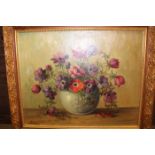 THREE OIL PAINTINGS
one an early 20th century floral still life, the other two 1970's seascapes,