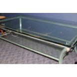 MODERN GLASS COFFEE TABLE 
with patinated green curving legs, with gilt feet,