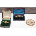 GROUP OF THREE BROOCHES
comprising of a fifteen carat gold seed pearl bar brooch,