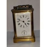 EARLY 20TH CENTURY BRASS CARRIAGE CLOCK
with Roman numerals and secondary hour dial,