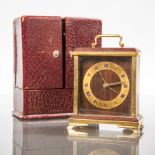 1950'S EIGHTEEN CARAT GOLD ROSEWOOD TRAVEL CLOCK
maker Faraone of Milan,