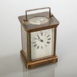 EARLY 20TH CENTURY BRASS CARRIAGE TIMEPIECE
with enamel Roman dial,