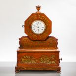 VICTORIAN BRASS INLAID ROSEWOOD MANTEL CLOCK
with an enamel Roman dial, the face of octagonal form,