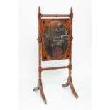 19TH CENTURY MAHOGANY CHEVAL MIRROR
the oval mirror set within a rectangular wooden frame and with