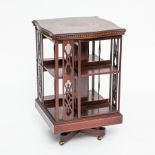 VICTORIAN MAHOGANY INLAID TWO TIER REVOLVING BOOKCASE
with pierced frame, on castors, 84cm high,