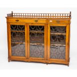 VICTORIAN WALNUT BOOKCASE
the three leaded glass doors under two drawers,