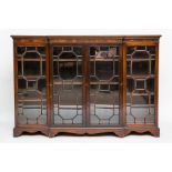 LATE VICTORIAN BREAKFRONT BOOKCASE
with four glazed doors and on bracket feet, 127cm high,