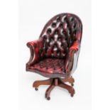 RED LEATHER BUTTON BACK CAPTAIN'S CHAIR
over mahogany frame and castors,