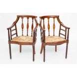 EDWARDIAN INLAID MAHOGANY ARMCHAIR
with scrolling arms and pierced backs,