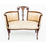 EDWARDIAN CONVERSATION SETTEE
with open centre section and carved rail, scrolling detail to splat,