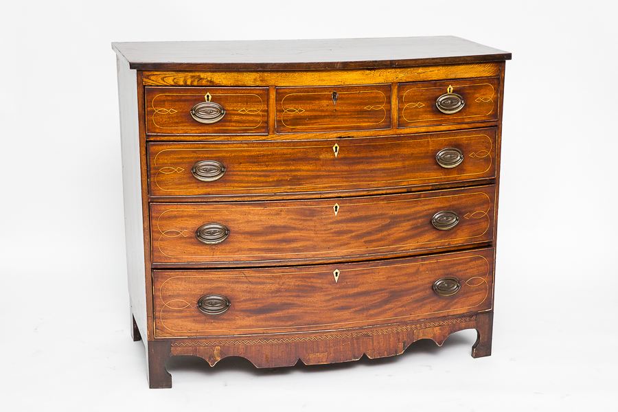 EARLY 19TH CENTURY BOW-FRONTED MAHOGANY CHEST OF DRAWERS
three short drawers over three long