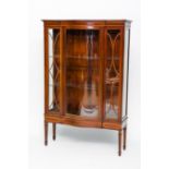 EARLY 20TH CENTURY BOW-FRONTED DISPLAY CABINET
with curved central door,