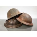 TWO WORLD WAR TWO BRODIE CROMWELL CIVILIAN MUNITIONS HELMETS
in leather and of 'battle-bowler' type,