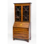 VICTORIAN SATINWOOD CROSSBANDED MAHOGANY BUREAU BOOKCASE 
with four drawers and shell motif,