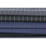 SIX LENGTHS OF PINSTRIPED ENGLISH SUIT FABRIC
including a suit length of black with board white