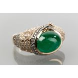 IMPRESSIVE EMERALD AND DIAMOND DRESS RING 
the central cabochon emerald of approximately 8.