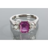 PINK SAPPHIRE AND DIAMOND THREE STONE RING
the central cushion cut pink sapphire approximately 1.