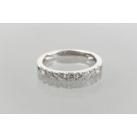 DIAMOND HALF ETERNITY RING with nine channel set brilliant cut diamonds totalling approximately 0.