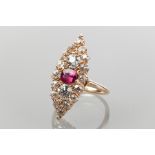 IMPRESSIVE MARQUISE SHAPED DIAMOND AND RUBY CLUSTER DRESS RING 
the central emerald cut ruby,