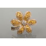 IMPRESSIVE YELLOW SAPPHIRE AND DIAMOND SET BROOCH
of floral form, with grain set square sapphires,