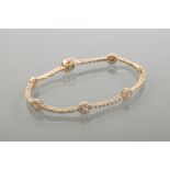 DIAMOND BRACELET
set with seven clusters of diamonds each separated by a row of diamonds,