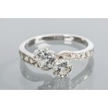 EARLY TWENTIETH CENTURY TWO STONE DIAMOND CROSSOVER RING
the two diamonds totalling approximately 0.