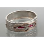 VICTORIAN SILVER BANGLE
with scrolling decoration and overlaid in gold,