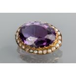AMETHYST AND PEARL BROOCH
with a large oval amethyst measuring 19.3 x 14.