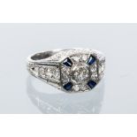 ART DECO SAPPHIRE AND DIAMOND RING
the square shaped bezel set with a central old cut diamond,