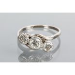 MID TWENTIETH CENTURY DIAMOND THREE STONE RING
the three old brilliant cut diamonds totalling