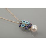 ENAMELLED FLOWER PENDANT
enamelled in two tones of blue, set with diamonds and rubies,