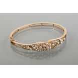 VICTORIAN PEARL SET BANGLE
set with split pearls in a floral design,