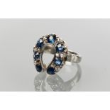 VICTORIAN DIAMOND AND SAPPHIRE HORSESHOE RING
set with alternating old cut sapphires and rose cut