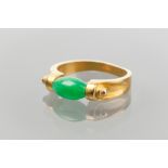 UNUSUAL JADEITE RING 
set with a green jadeite bead, in unmarked high carat gold,