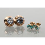 TWO PAIRS OF BLUE GEM STUD EARRINGS
one pair set with round blue gems,