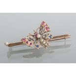 LATE NINETEENTH CENTURY BUTTERFLY BAR BROOCH
set with diamonds, rubies, sapphires and pearls,