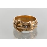 GENTLEMAN'S VICTORIAN DIAMOND SET BELT MOTIF RING
set with two diamonds, in eighteen carat gold,