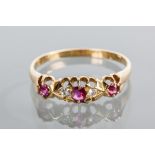 VICTORIAN RUBY AND DIAMOND RING
set with alternating rubies and diamonds in a bezel with pierced