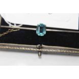 NINE CARAT GOLD AND TOPAZ SET BAR BROOCH
with its original box