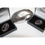 TWO SILVER RENNIE MACINTOSH BROOCHES
both of oval form,