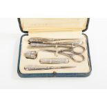 SILVER SEWING SET
unmarked, possibly Continental, handles embossed with floral design,