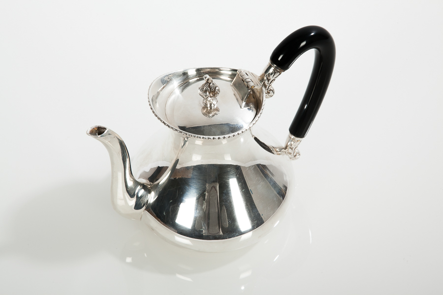 IMPORT SILVER TEAPOT
stamped 'Silver Ptd By Hrushi', approximately 566g, 14.