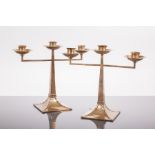 PAIR OF GEORGE V ARTS & CRAFTS STYLE TWIN-BRANCH CANDLESTICKS
maker James Dixon & Sons,