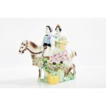 19TH CENTURY STAFFORDSHIRE FIGURE GROUP
of two figures on horseback,