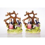 PAIR OF 19TH CENTURY STAFFORDSHIRE FIGURES 
depicting a man and a woman in traditional Scottish