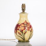 MOORCROFT 'AFRICAN LILY' PATTERN LAMP
decorated with a spray of three lilies to one side and a