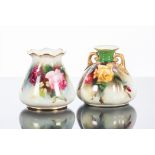 TWO ROYAL WORCESTER SMALL VASES
of squat baluster form and tapering form,